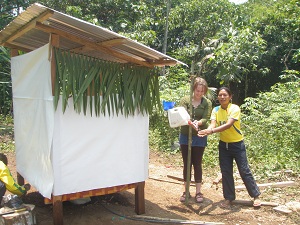 volunteers at dry toilet 